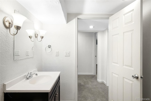 6015 Everett St, Arvada, CO 80004 - bathroom featuring vanity and baseboards
