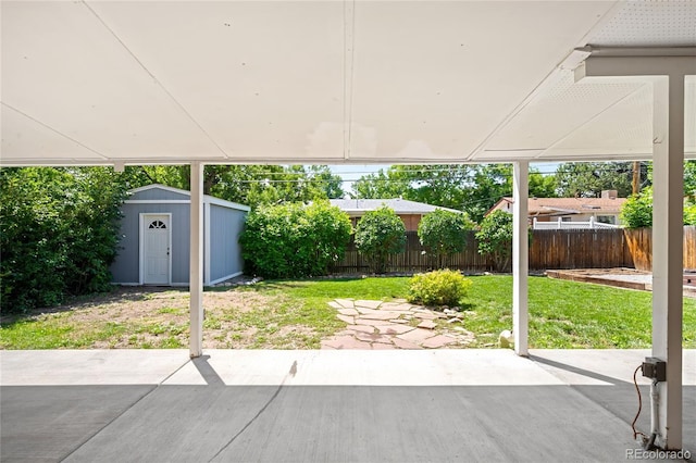 6015 Everett St, Arvada, CO 80004 - fenced backyard with a storage shed and a patio area