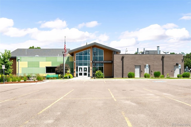 6015 Everett St, Arvada, CO 80004 - view of building exterior featuring uncovered parking