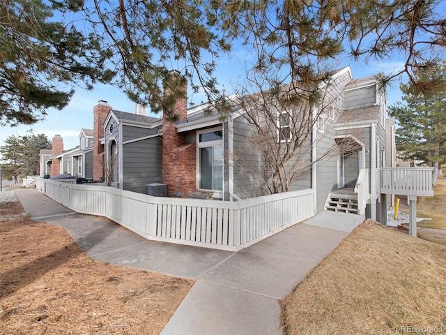 view of side of home featuring a lawn