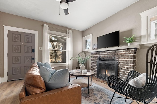 3725 Federal Blvd, Denver, CO 80211 - living room with wood finished floors, a fireplace, and ceiling fan