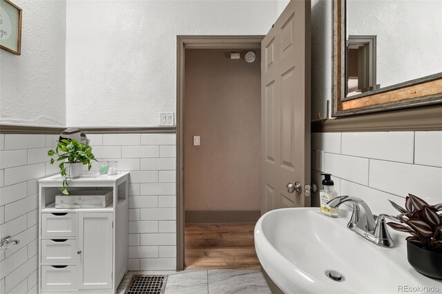 3725 Federal Blvd, Denver, CO 80211 - bathroom featuring tile walls, wainscoting, and vanity
