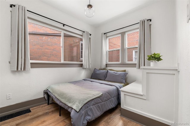 3725 Federal Blvd, Denver, CO 80211 - bedroom featuring baseboards and wood finished floors