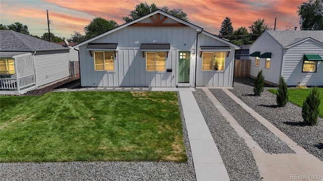 modern farmhouse featuring a lawn