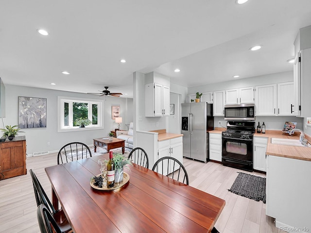 13246 Deneb Dr, Lone Tree, CO 80124 - dining area with light wood finished floors, recessed lighting, and a ceiling fan