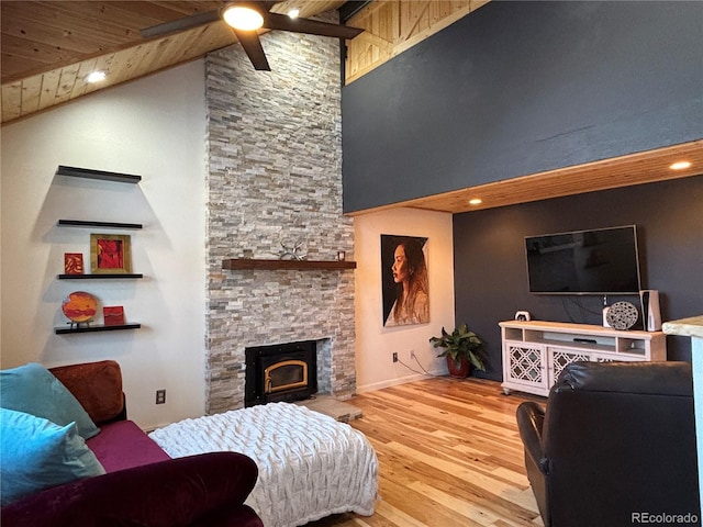 living room with wood ceiling, a fireplace, high vaulted ceiling, and hardwood / wood-style flooring