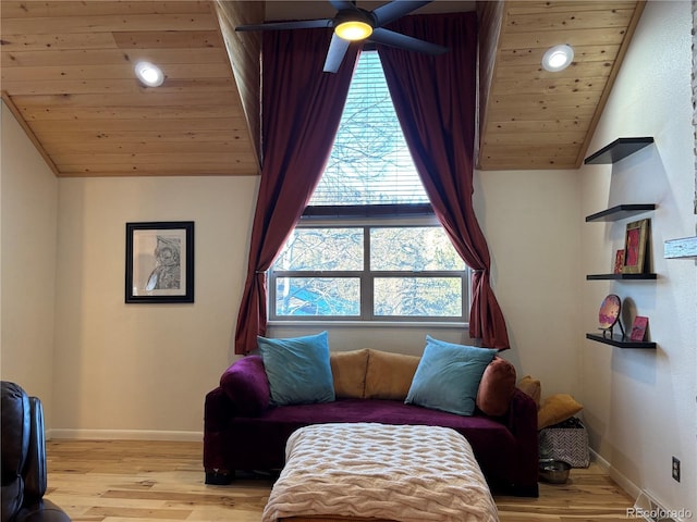 living area featuring light wood-type flooring, ceiling fan, vaulted ceiling, and wooden ceiling