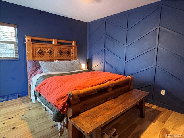 bedroom with light hardwood / wood-style floors