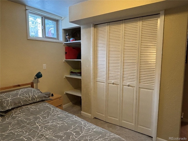 unfurnished bedroom featuring carpet floors and a closet