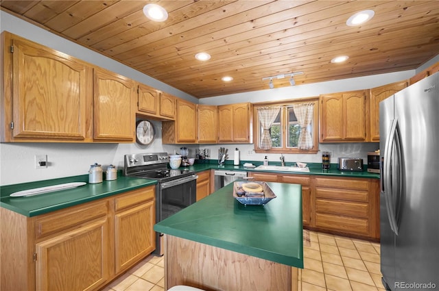 kitchen featuring light tile patterned flooring, recessed lighting, appliances with stainless steel finishes, and a sink