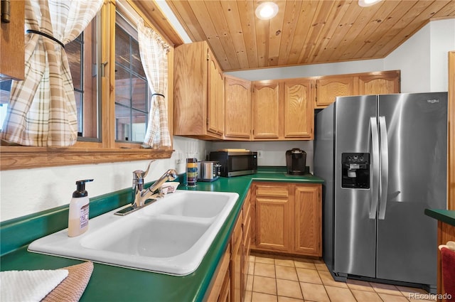 kitchen featuring light tile patterned floors, appliances with stainless steel finishes, wood ceiling, and a sink