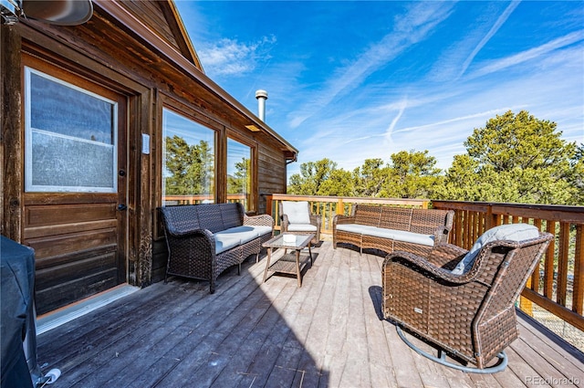 wooden terrace with outdoor lounge area