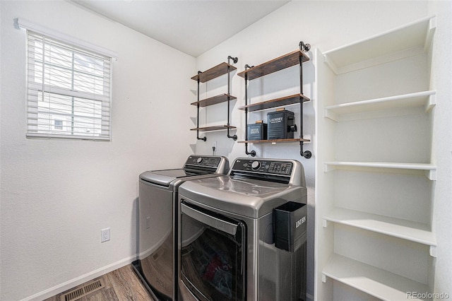 3934 N Quatar Ct, Aurora, CO 80019 - laundry room with separate washer and dryer and wood finished floors