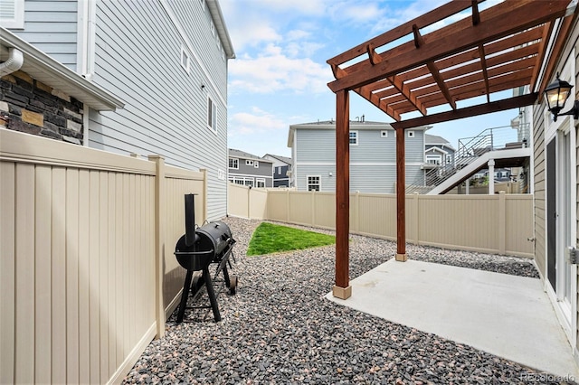 3934 N Quatar Ct, Aurora, CO 80019 - fenced backyard featuring a grill, a pergola, and a patio area