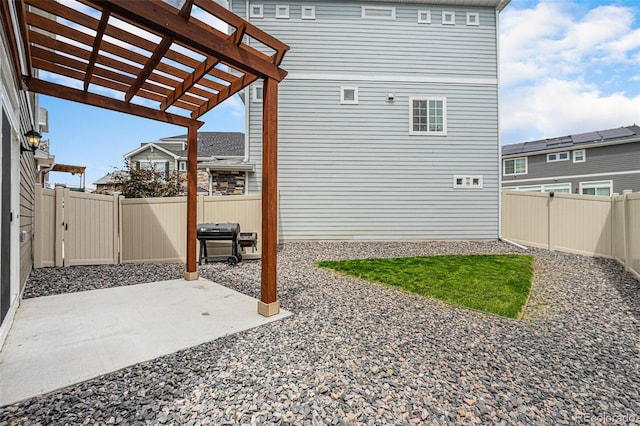 3934 N Quatar Ct, Aurora, CO 80019 - fenced backyard with a patio and a pergola