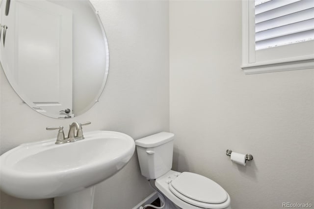 bathroom with sink and toilet