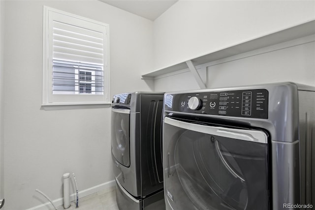 clothes washing area featuring washing machine and clothes dryer