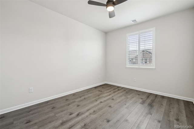 empty room with wood-type flooring and ceiling fan