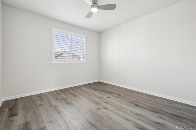 unfurnished room with wood-type flooring and ceiling fan