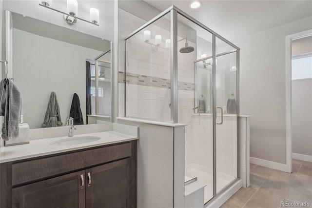 bathroom with vanity, tile patterned floors, and walk in shower