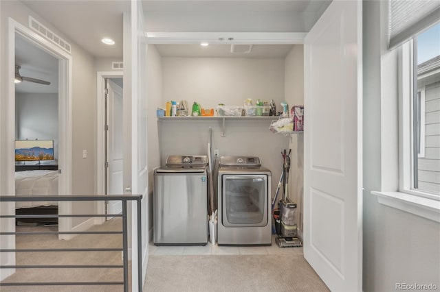 washroom with washer and clothes dryer, ceiling fan, and light tile patterned flooring