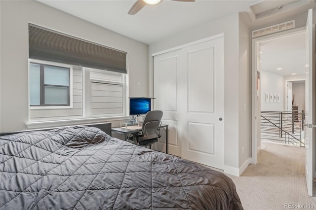 bedroom with light carpet, a closet, and ceiling fan