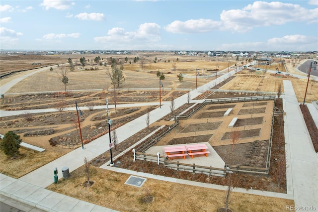 birds eye view of property with a rural view