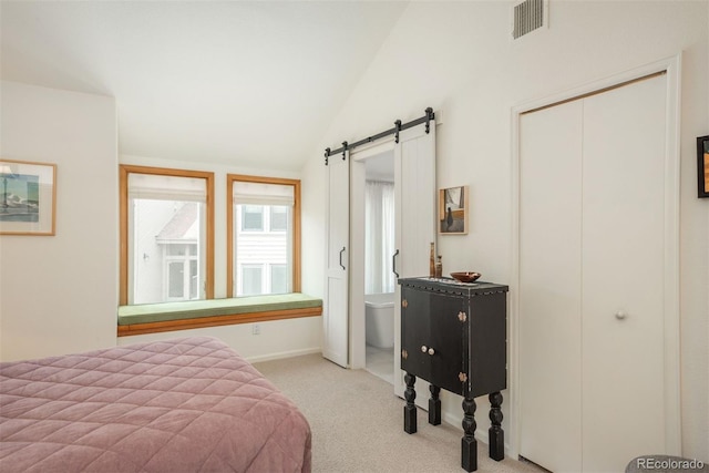 23624 Pondview Pl Unit G, Golden, CO 80401 - bedroom featuring carpet floors, vaulted ceiling, a barn door, and a closet