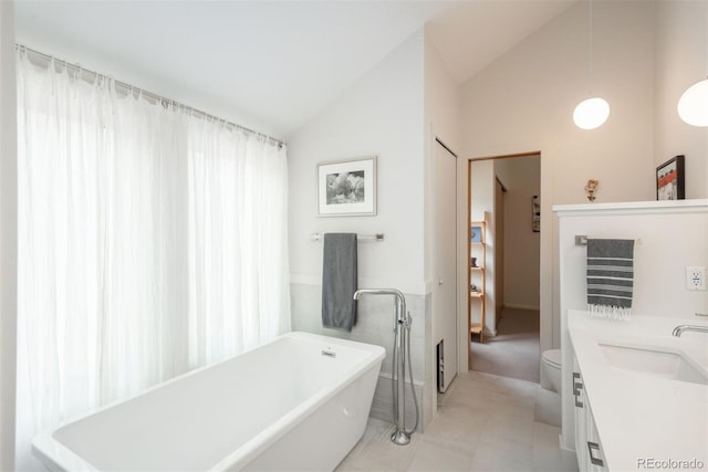 23624 Pondview Pl Unit G, Golden, CO 80401 - bathroom with vaulted ceiling, a freestanding tub, and vanity