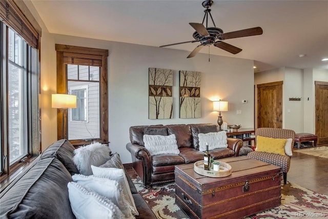 living room featuring ceiling fan and hardwood / wood-style floors