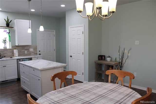 kitchen with decorative backsplash, white cabinets, dark wood-style flooring, and recessed lighting