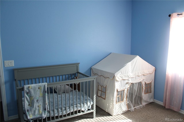 carpeted bedroom with baseboards