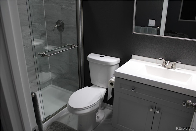 bathroom featuring a stall shower, vanity, toilet, and marble finish floors