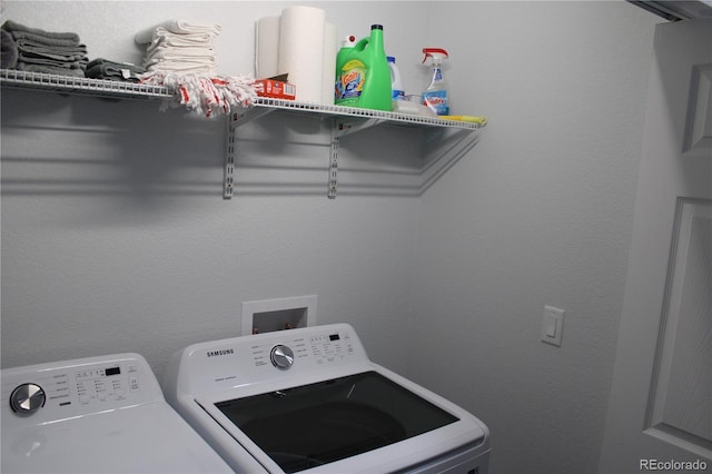 clothes washing area with washing machine and clothes dryer