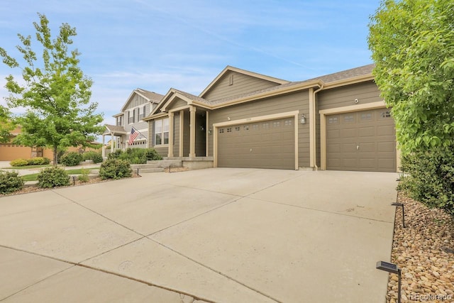 19210 E Pacific Pl, Aurora, CO 80013 - view of front facade with driveway and a garage
