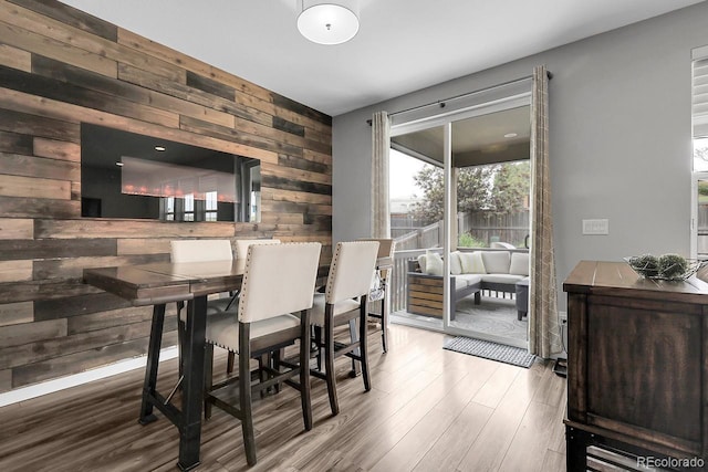 19210 E Pacific Pl, Aurora, CO 80013 - dining space featuring wooden walls and wood finished floors