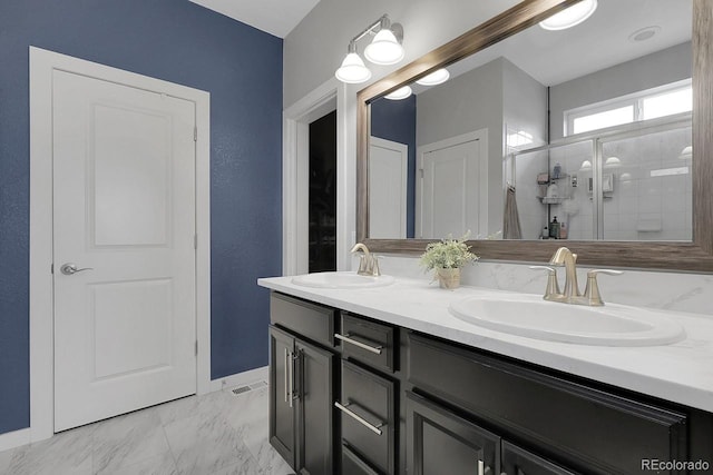19210 E Pacific Pl, Aurora, CO 80013 - bathroom featuring double vanity, a stall shower, and marble look tile flooring