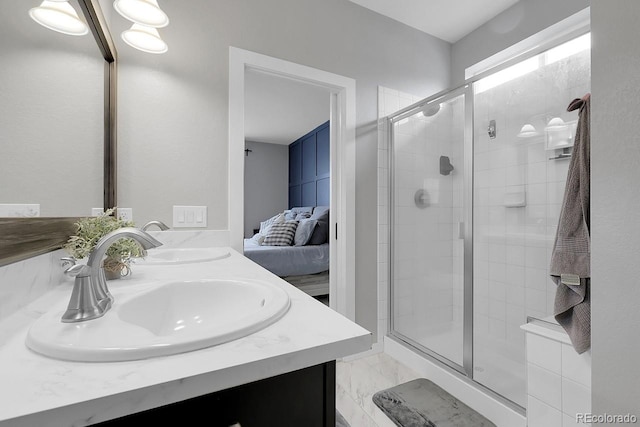 19210 E Pacific Pl, Aurora, CO 80013 - ensuite bathroom featuring double vanity, a shower stall, and marble look tiles