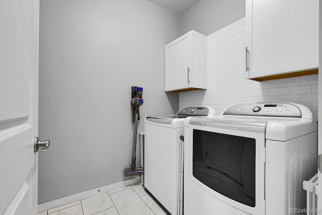 19210 E Pacific Pl, Aurora, CO 80013 - laundry room with separate washer and dryer, cabinet space, and light marble finish floors