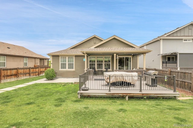 19210 E Pacific Pl, Aurora, CO 80013 - back of house featuring a fenced backyard, roof with shingles, and a wooden deck