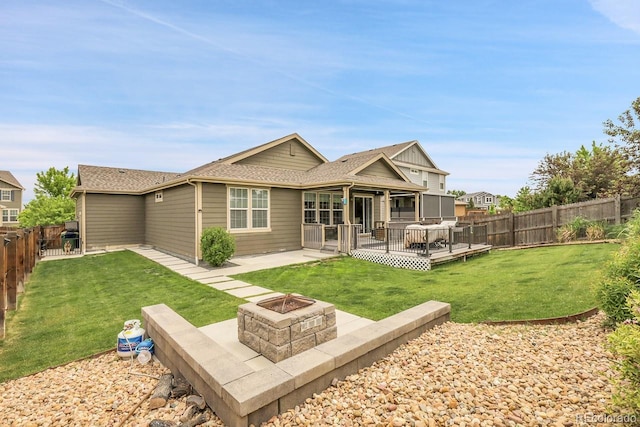 19210 E Pacific Pl, Aurora, CO 80013 - rear view of property featuring a fire pit, a fenced backyard, a deck, a patio, and a shingled roof