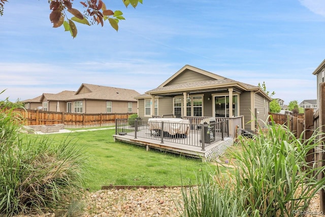 19210 E Pacific Pl, Aurora, CO 80013 - back of house with a fenced backyard, a wooden deck, and a shingled roof