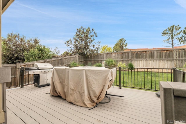19210 E Pacific Pl, Aurora, CO 80013 - wooden deck with a grill and a fenced backyard