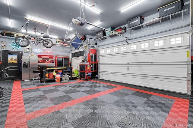 19210 E Pacific Pl, Aurora, CO 80013 - garage featuring stainless steel refrigerator with ice dispenser and a garage door opener