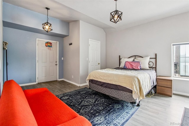 915 26th St, Denver, CO 80205 - bedroom featuring wood finished floors and baseboards