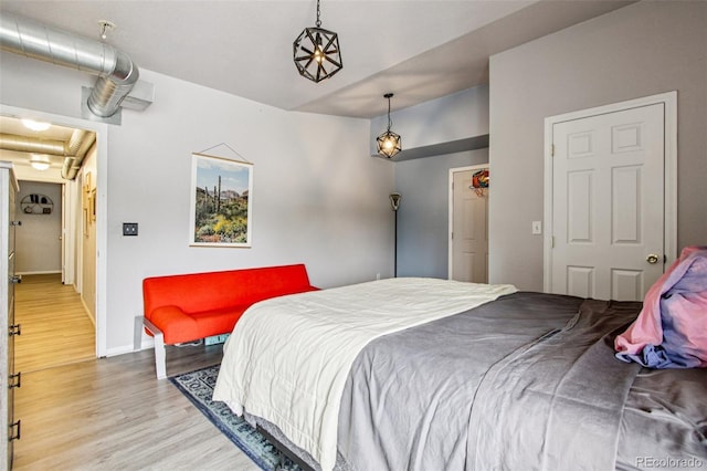 915 26th St, Denver, CO 80205 - bedroom featuring wood finished floors and baseboards