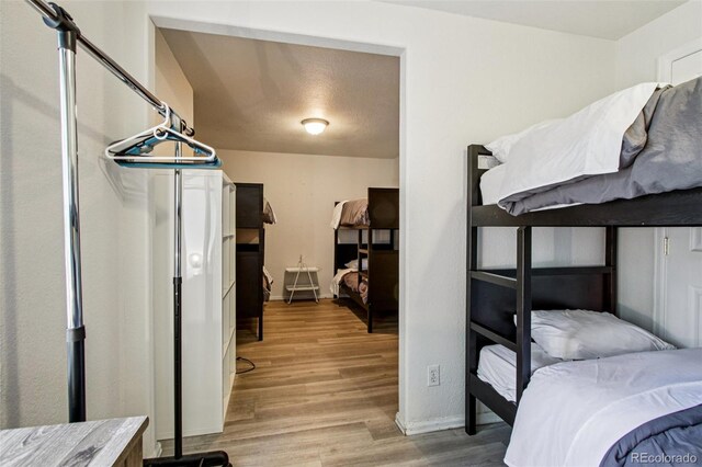 915 26th St, Denver, CO 80205 - bedroom featuring light wood finished floors and baseboards