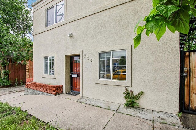 915 26th St, Denver, CO 80205 - property entrance with stucco siding and a patio area