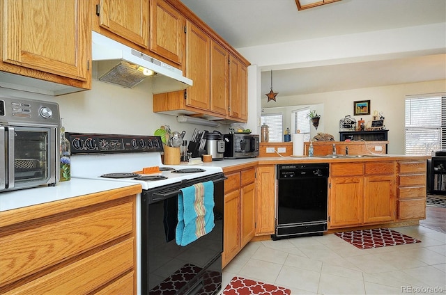 kitchen with under cabinet range hood, dishwasher, light countertops, and electric range oven