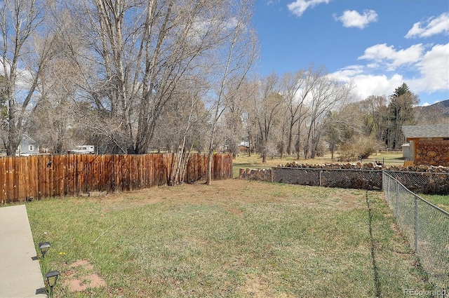 view of yard with a fenced backyard